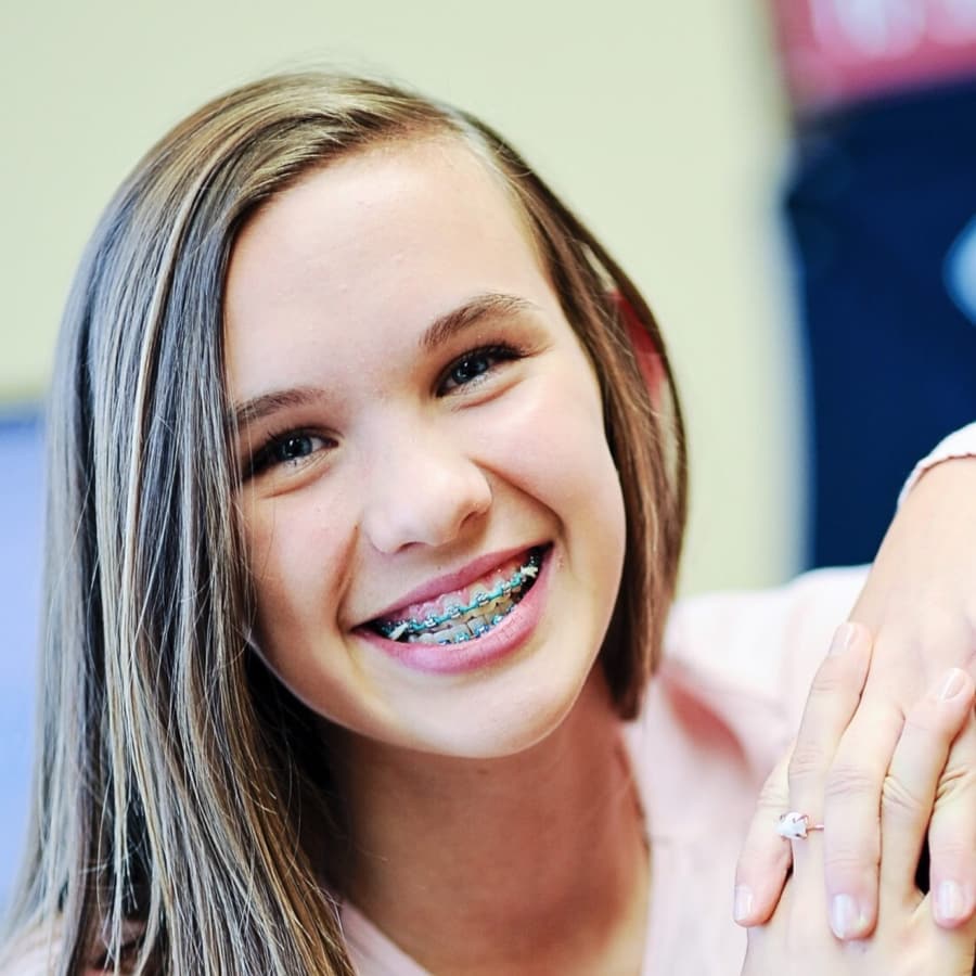 teen wearing metal braces